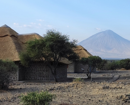 A picture of the Africa Safari Lake Natron Lodge premises with Ol Doinyo Lengai mountain in the background